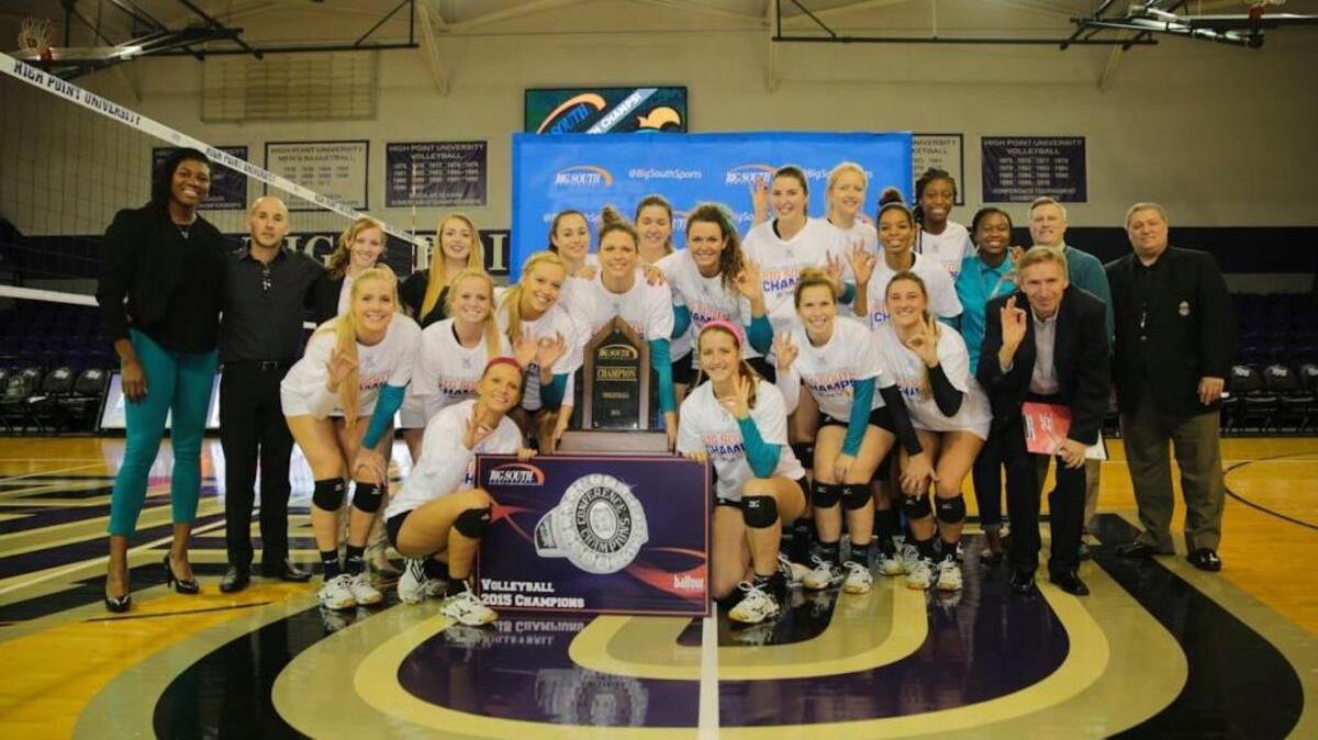 The Coastal Carolina volleyball team poses for a picture after winning the Big South tournament Sunday.