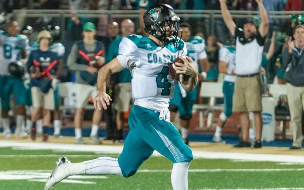 Coastal Carolina quarterback Alex Ross scores a touchdown against Charleston Southern on Saturday.