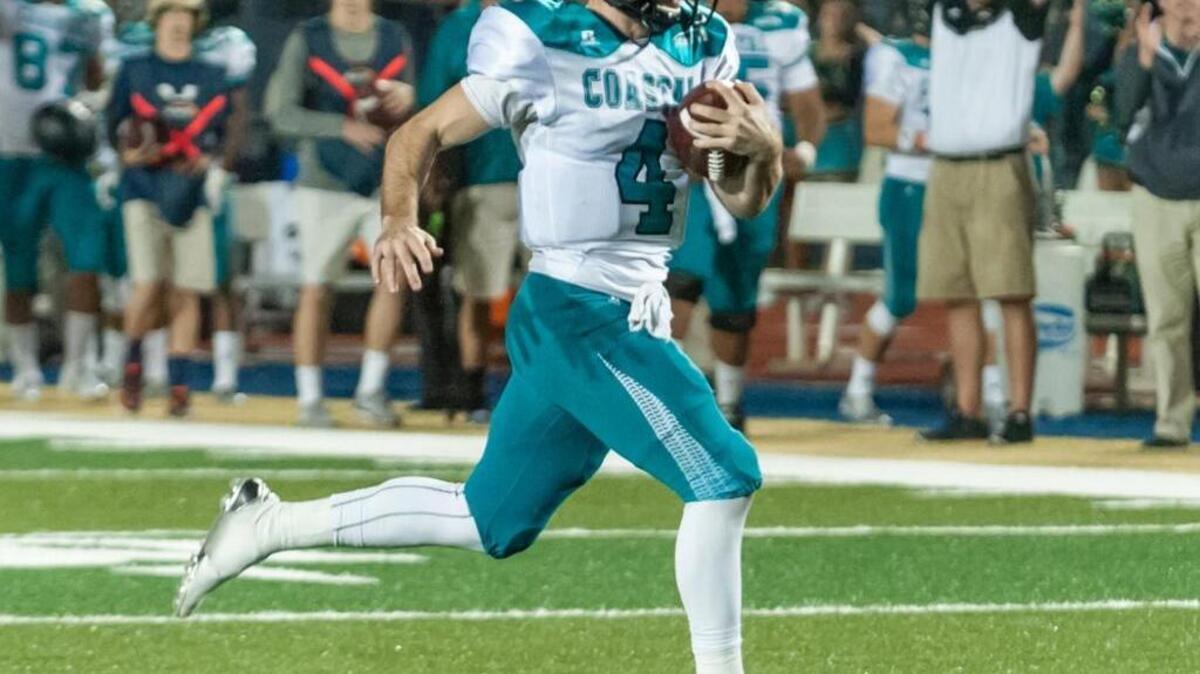 Coastal Carolina quarterback Alex Ross scores a touchdown against Charleston Southern on Saturday.