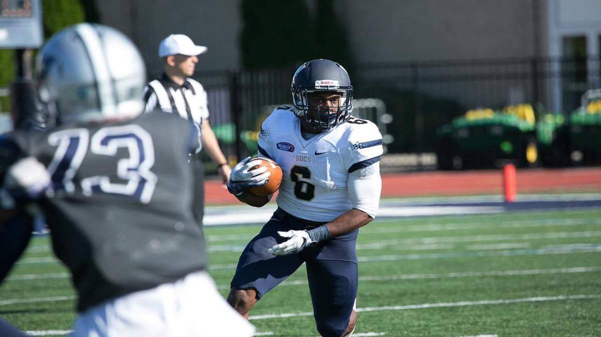 Charleston Southern running back Mike Holloway carries the ball for some of his 214 all-purpose yards last week against Monmouth.