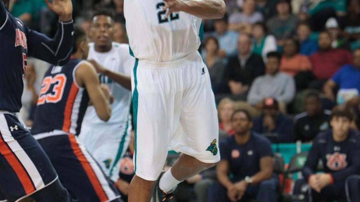 Coastal Carolina’s Elijah Wilson goes up for a shot against Auburn.