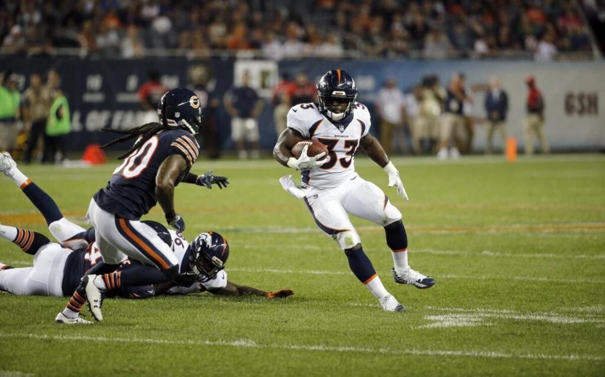 Denver Broncos running back De'Angelo Henderson, who was named to the team’s 53-man roster Saturday, looks for running room against Chicago during the preseason.