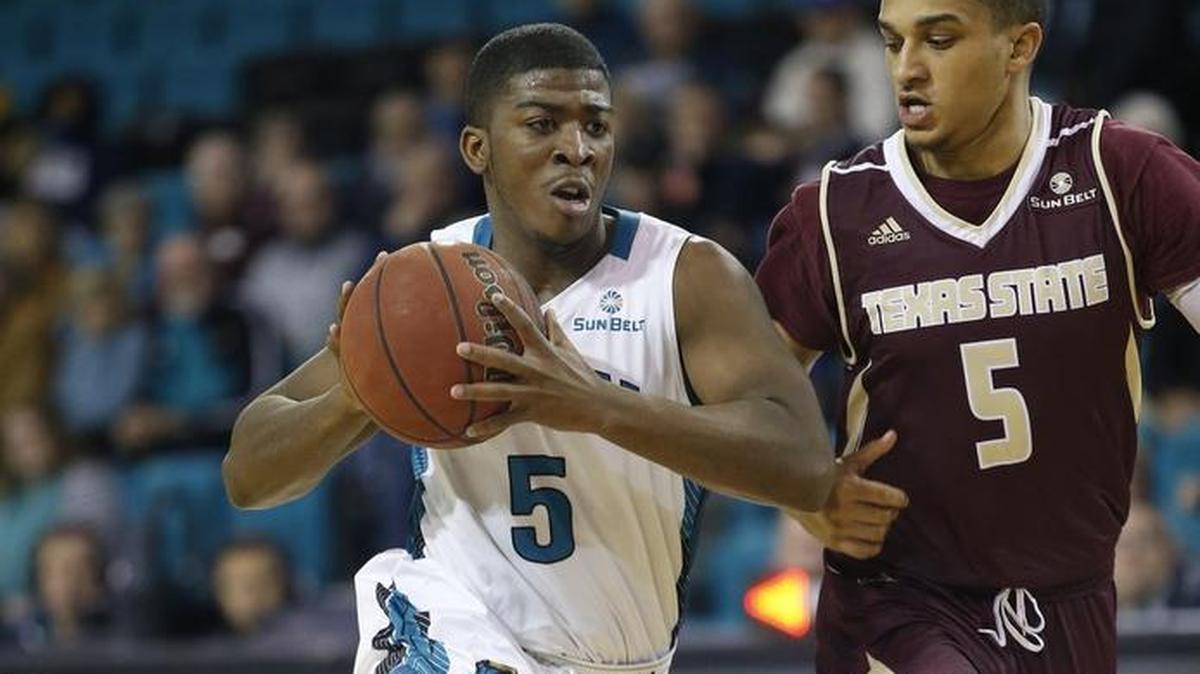 Coastal Carolina senior guard Jaylen Shaw of Hartsville drives to the basket against Texas State’s Marlin Davis on Dec. 31 at the HTC Center in Conway. A 53-48 loss began a current five-game losing streak.