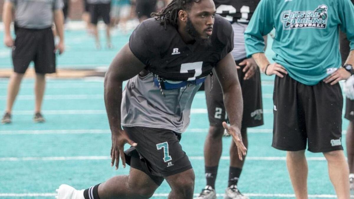 
CCU Linebacker Devon Brant looks to make a play at practice Thursday.
