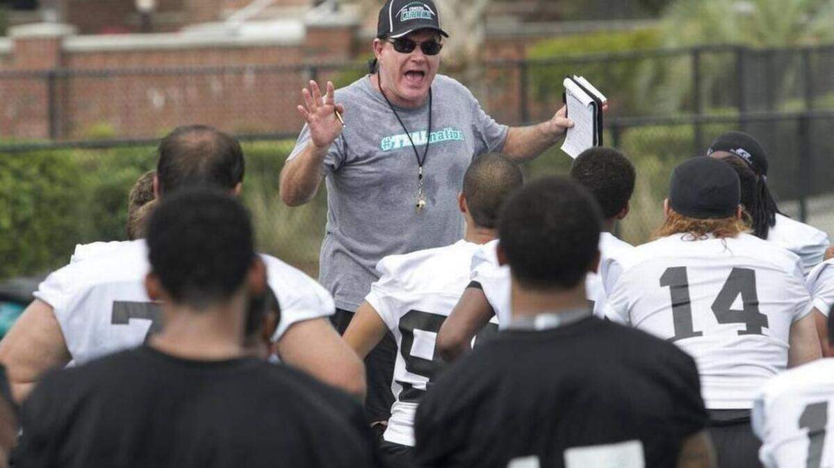 CCU coach Joe Moglia talks to his players after a practice.