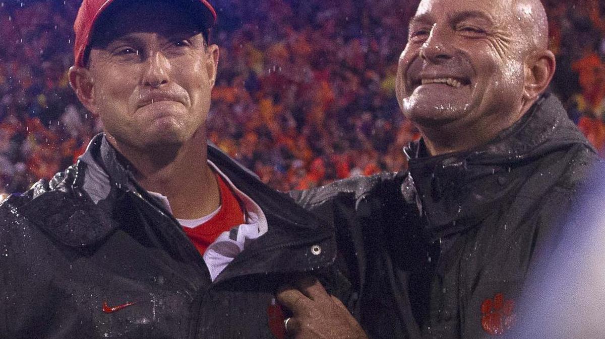 Oct 3, 2015; Clemson, SC, USA; Clemson Tigers head coach Dabo Swinney (left) and his brother Tracy Swinney (right) celebrate after the Tigers won 24-22 against the Notre Dame Fighting Irish at Clemson Memorial Stadium. Mandatory Credit: Joshua S. Kelly-USA TODAY Sports