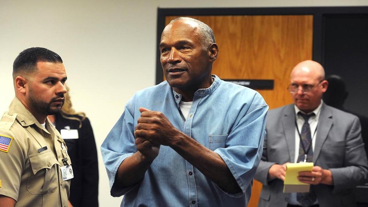 Former football star O.J. Simpson reacts after learning he was granted parole at Lovelock Correctional Center in Lovelock, Nev., on Thursday.