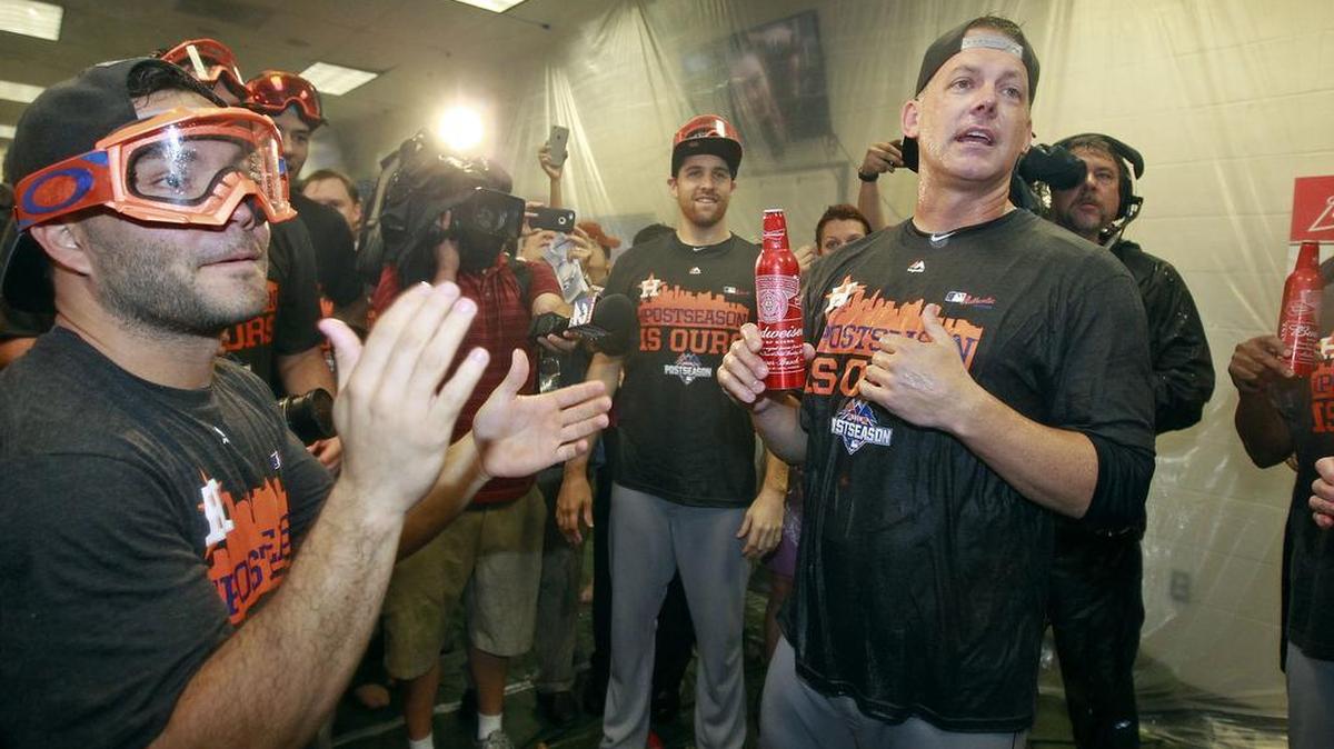 
Houston Astros manager A.J. Hinch, right, speaks to Jose Altuve, left, and the team during a celebration of their AL wild card playoff berth. The Astros will travel to face the N.Y. Yankees on Tuesday. 
