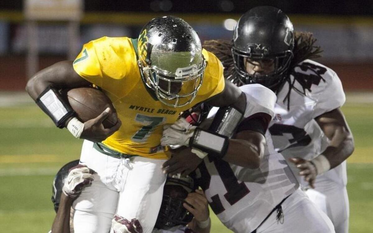 
Myrtle Beach wide receiver Cortez Brown, 7, looks to get extra yardage against Carolina Forest defenders on Friday. The Seahawks (2-3) face off with the high-scoring Conway Tigers (4-1) on Friday for the Victory Bell trophy. 
