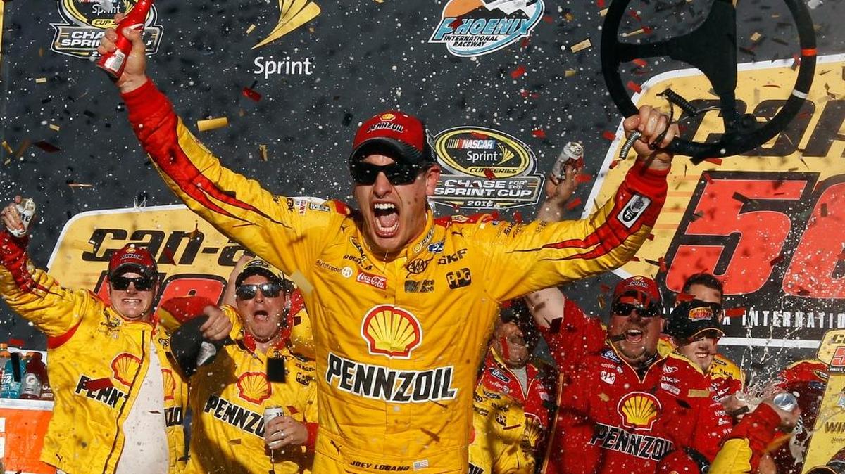 Joey Logano celebrates in Victory Lane after winning Sunday’s at Phoenix International Raceway.