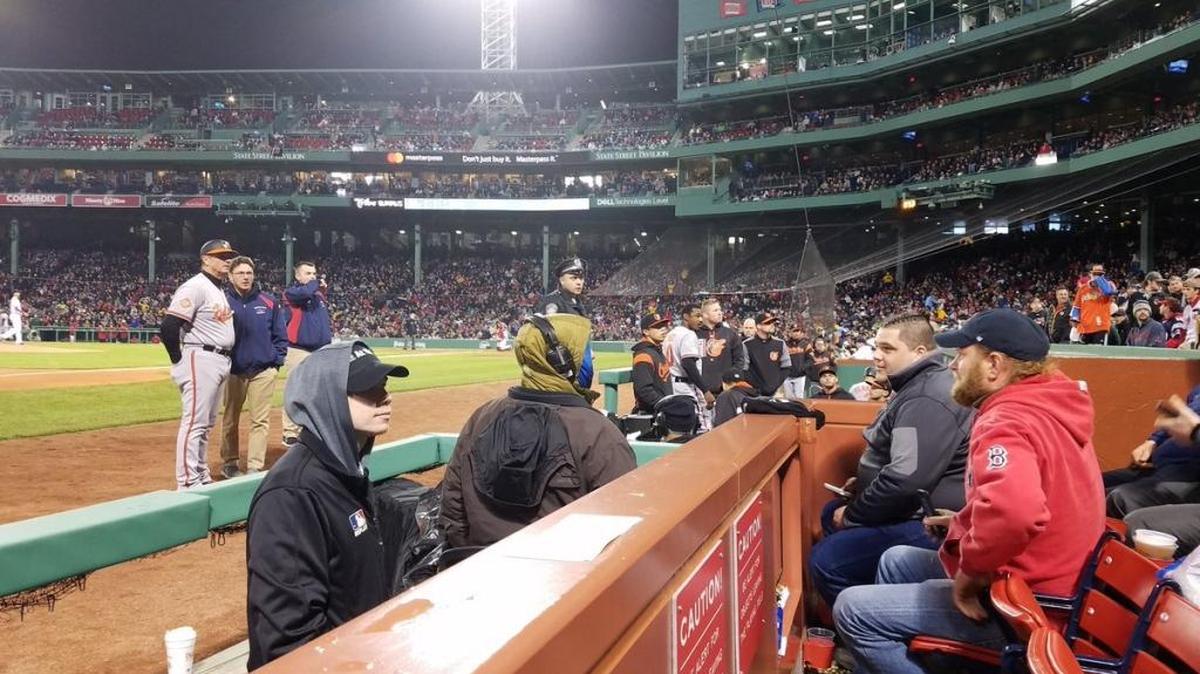 In this photo provided by Avi Miller, security watches after Baltimore Orioles center fielder Adam Jones was taunted by racial slurs at Fenway Park in Boston on May 1.