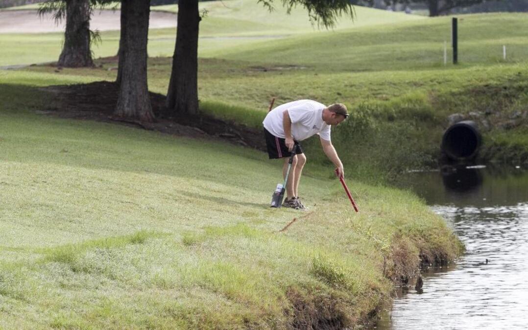 
Brad Crumling, head professional at Myrtle Beach National, marks the course in preparation for the Myrtle Beach World Amateur Handicap Championship.
