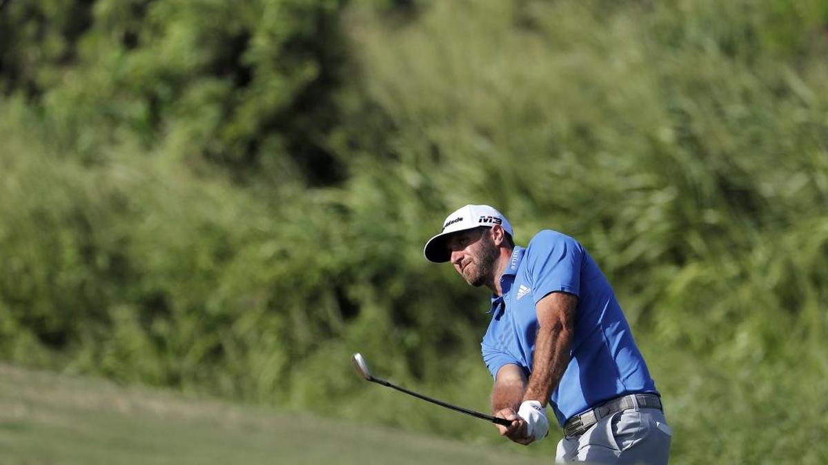 Dustin Johnson hits onto the 12th green during the second round of the Tournament of Champions golf event, Friday, Jan. 5, 2018, at Kapalua Plantation Course in Kapalua, Hawaii.