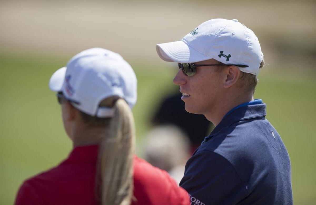 Former CCU golfer Drew Ernst (right) talks with sister Austin, for whom he caddies, during the Hootie & the Blowfish Monday after the 2016 Masters Celebrity Pro-Am at Barefoot Resort.