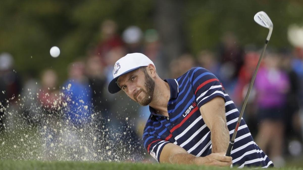Dustin Johnson hits from a bunker on the 12th hole at Hazeltine National Golf Club in Chaska, Minn., during a practice round for the Ryder Cup on Thursday.