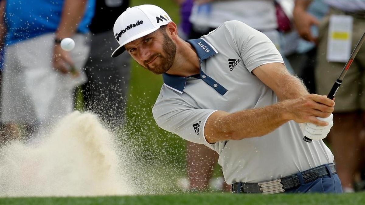 Dustin Johnson hits out of the bunker on the 12th hole during a practice round for the U.S. Open golf championship at Oakmont Country Club on Wednesday, June 15, 2016, in Oakmont, Pa.