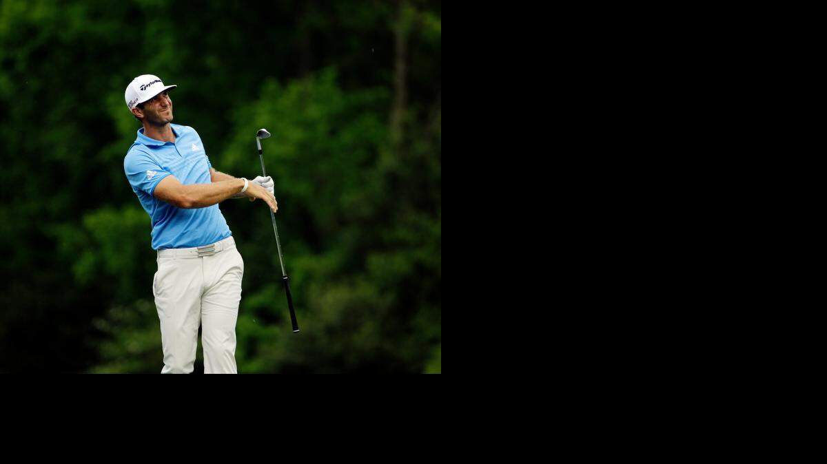 
Dustin Johnson watches his shot on the 12th tee box during the second round of the Masters.
