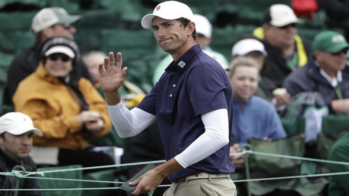 Stewart Hagestad waves after putting on the 18th hole during the first round of the Masters.