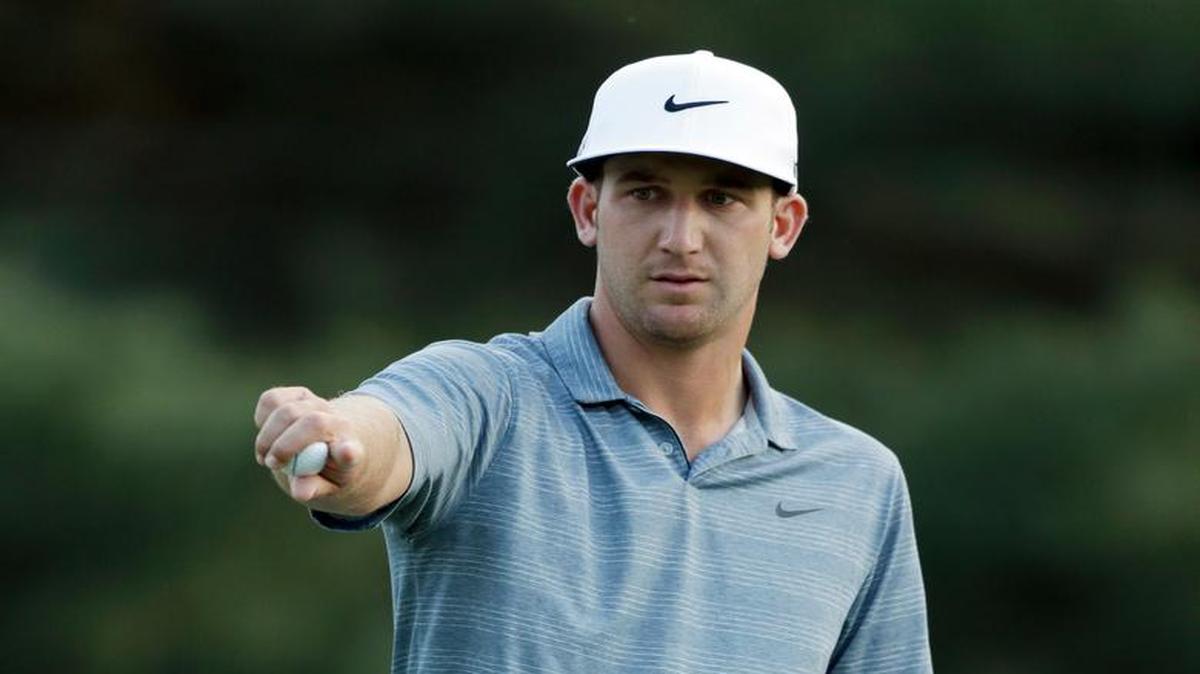 
Kevin Chappell points to a playing partner before putting on the ninth hole during the first round of the Wells Fargo Championship.
