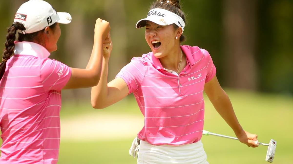 Jennifer Chang celebrates a birdie putt at the eighth hole with her partner, Gina Kim, during the quarterfinal round of match play at the 2017 U.S. Women’s Amateur Four-Ball at The Dunes Golf & Beach Club.