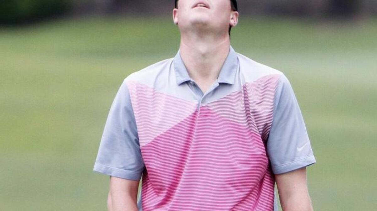 Casey Johnson flips his putter after a close call with the hole in a six-hole playoff in The Palmetto State Open at River Hills Golf & Country Club.