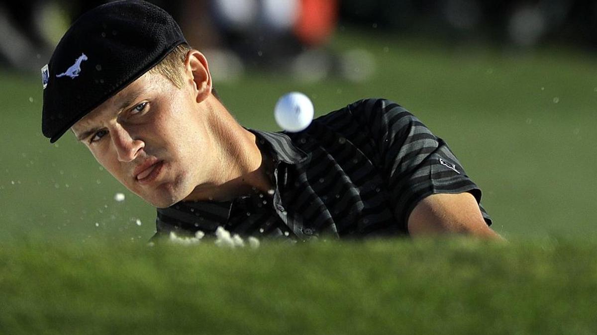 Bryson DeChambeau hits out of a bunker on the 18th hole during the third round of the Masters. He is making his pro debut this week in Hilton Head Island