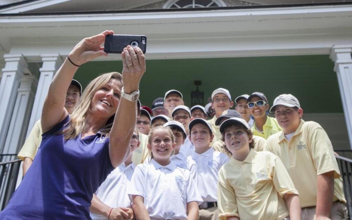 Kelly Tilghman takes a selfie with the youth of First Tee of the Grand Strand during it's fundraising Future Generations Tournament at Caledonia Golf & Fish Club on Tuesday.