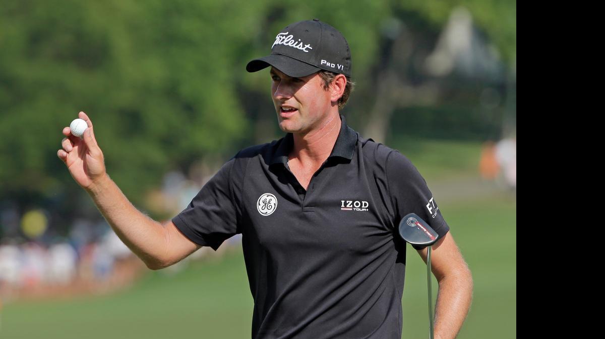 
Webb Simpson waves to the crowd after making a birdie putt on the 15th hole during the second round of the Wells Fargo Championship.
