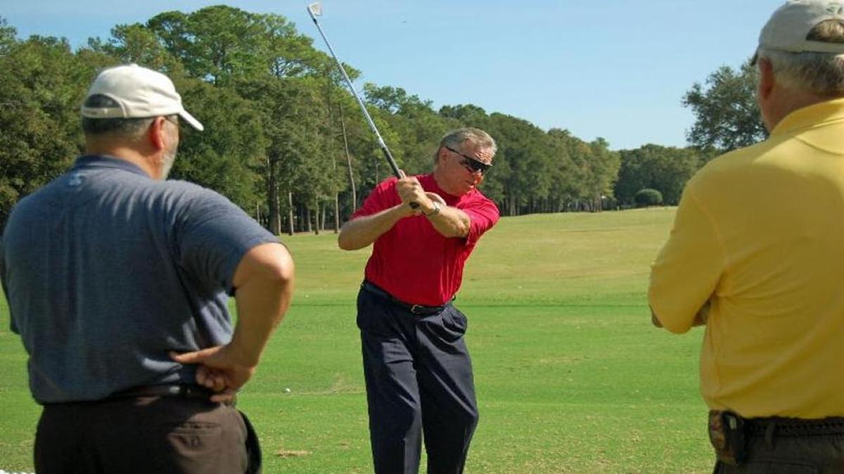 Mel Sole (middle) works with students at his golf school. Sole now has two locations on the Grand Strand at Tupelo Bay Golf Center and Sea Trail Golf Resort & Conference Center.