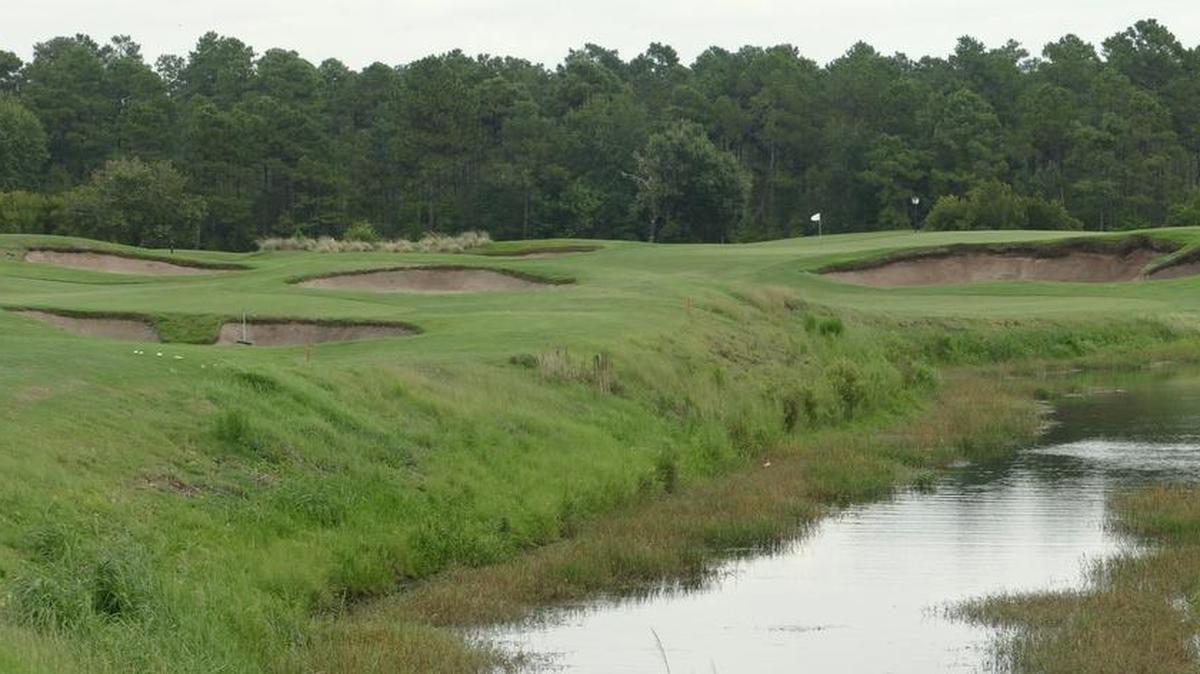 
The short par-4 ninth hole on the Parkland course at Legends Golf Resort has an elevated green high above a deep front bunker at its base.

