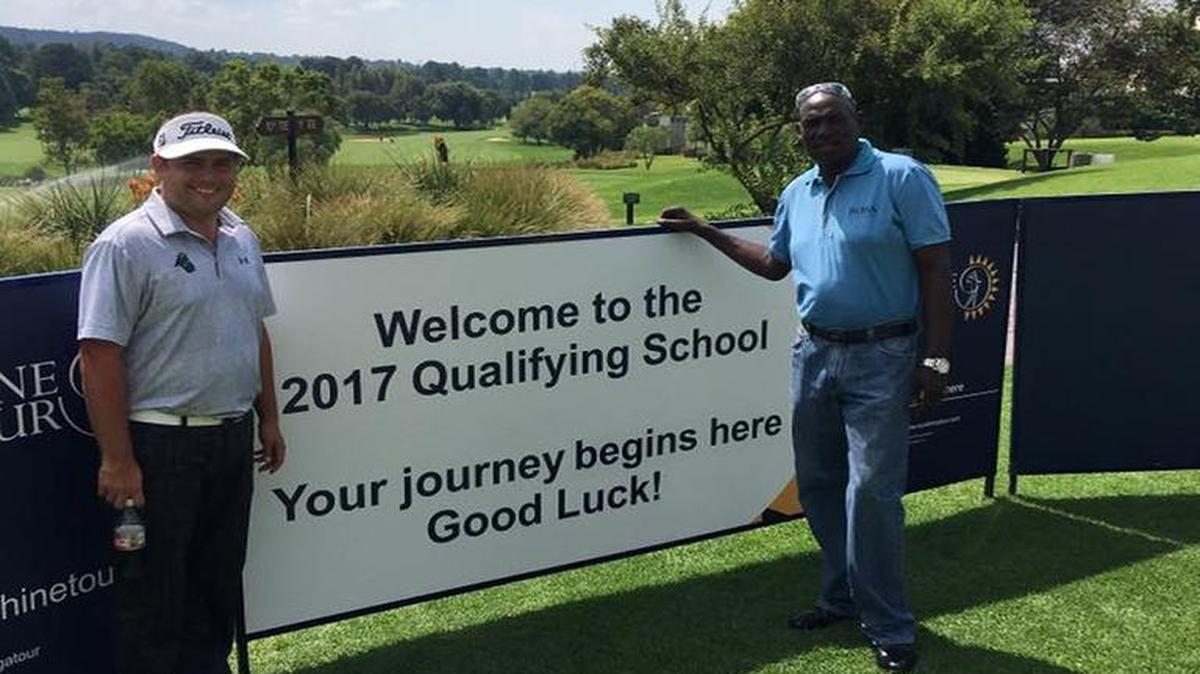 Zack Byrd poses with his caddie at the Sunshine Tour Qualifying Tournament in Randpark, South Africa.