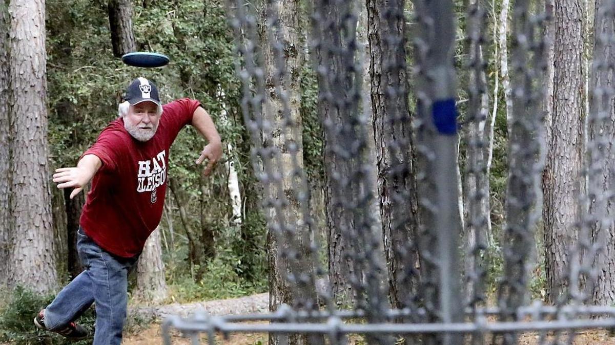 Tom Housner plays on the the 18-hole disc golf course he helped build at the Socastee Recreation Park. The park off Butler Road will be hosting the fourth annual Myrtle Beach Invitational disc golf tournament on Feb. 3.