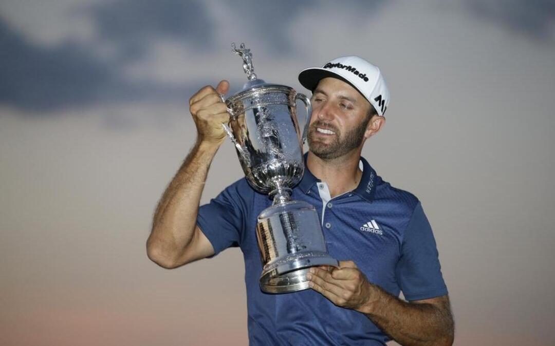 Dustin Johnson holds the trophy after winning the U.S. Open on June 19.
