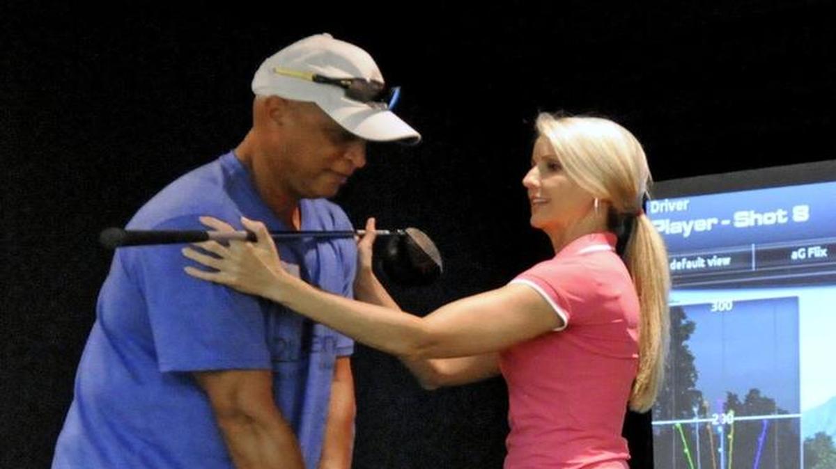 Meredith Kirk works with a student last year. Kirk has joined the staff of the Dustin Johnson Golf School.