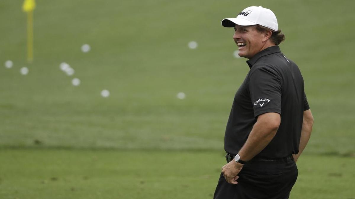 Phil Mickelson laughs on the range Wednesday at Augusta National Golf Club, where he is trying to become the oldest Masters champion at the age of 46.