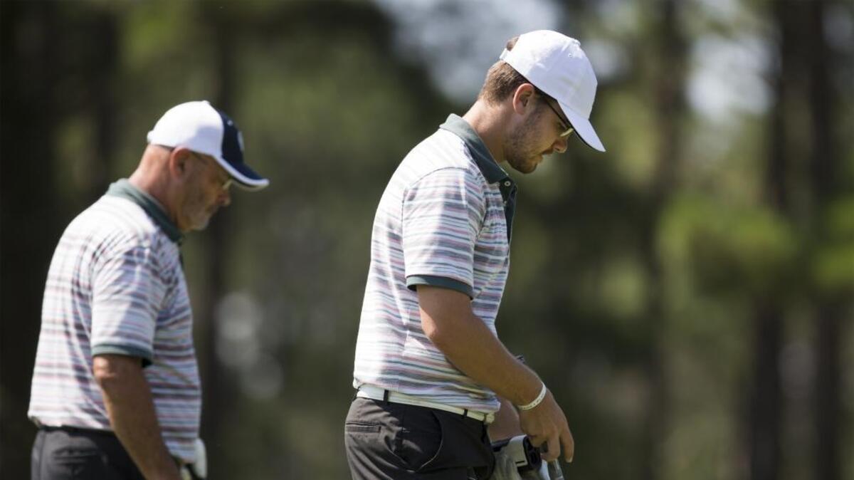 Daniel Graves (right) and his father Michael Graves of North Myrtle Beach approach a tee during the 20th National Father & Son Team Classic in July on the Parkland Course at Legends Golf Resort.