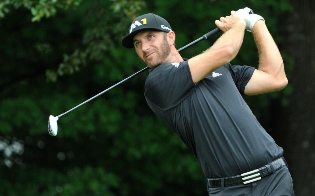 
Dustin Johnson tees off on the third hole during the second round of the Tour Championship.
