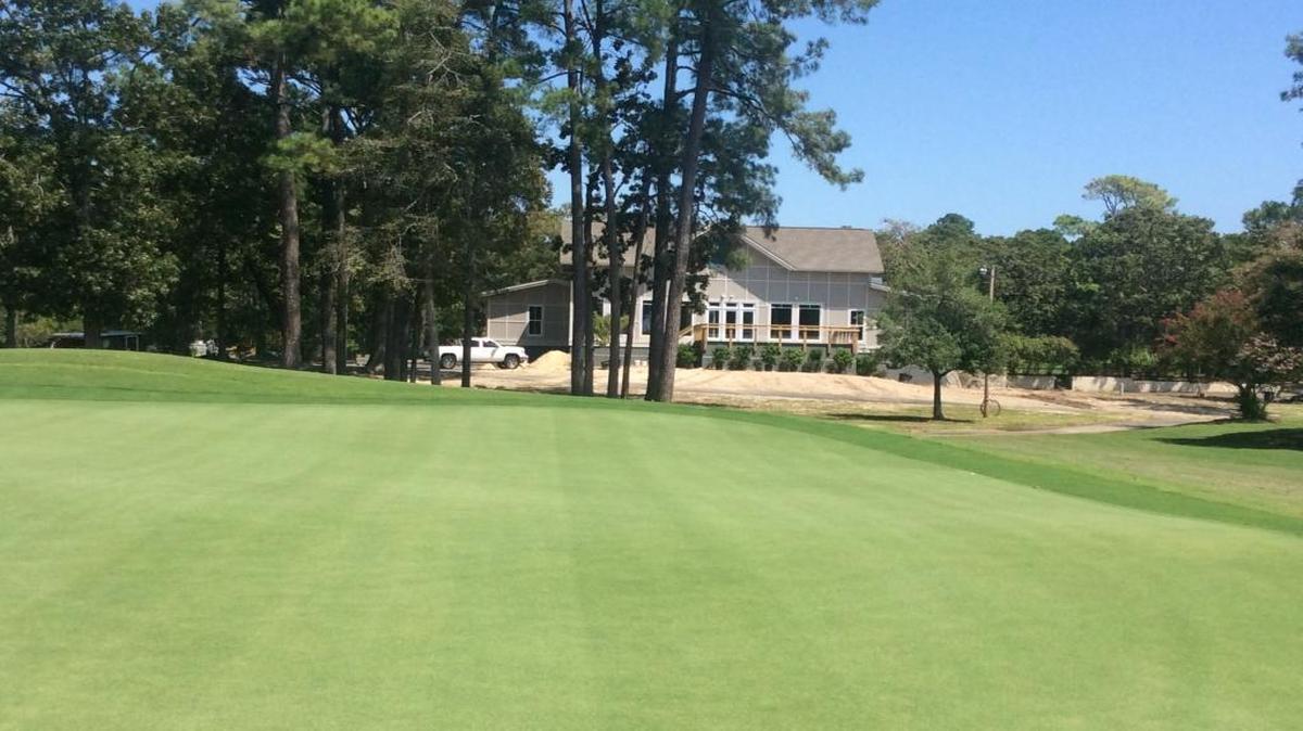 Arcadian Shores Golf Club’s new clubhouse is in view behind the 18th green, which now has Sunday ultradwarf Bermudagrass.