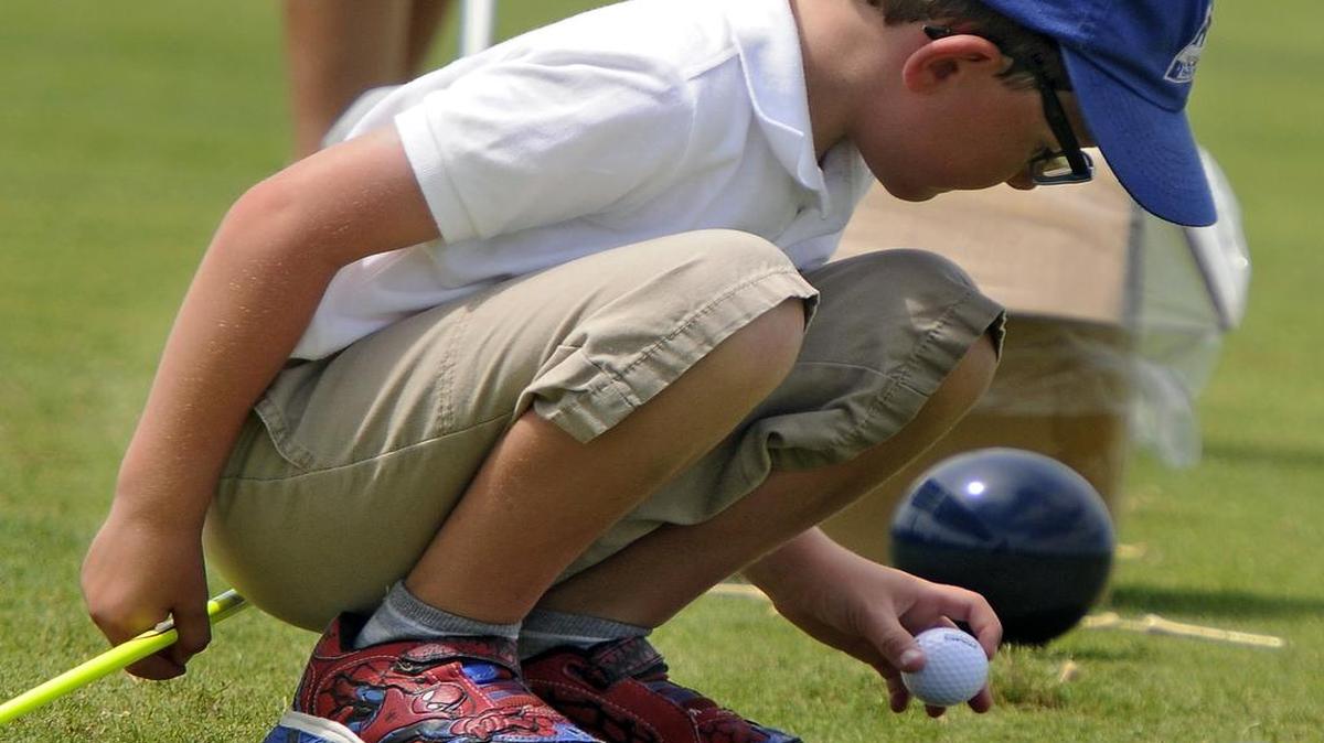 
Allen Michael Kraus of Wilmington, N.C., places his ball on the tee during the Drive round in the Boys 7-9 division of the of the 2015-16 Drive Chip & Putt local qualifier at Legends Resort, Tuesday morning.
