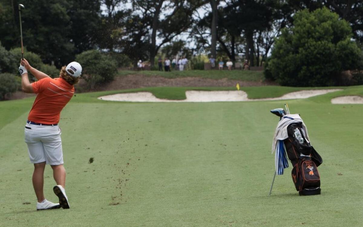 Zachary Bauchou of Forest, Va, hits from the fairway on the 18th hole of The Dunes Golf and Beach Club during the 110th Southern Amateur Championship in July 2016.