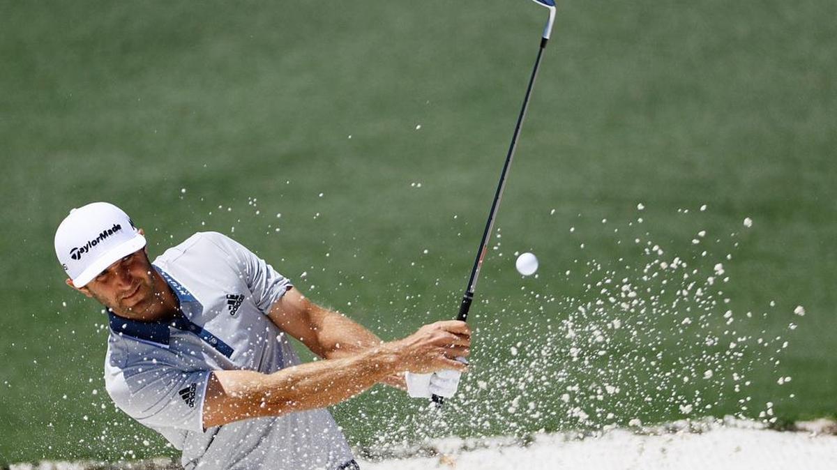 Dustin Johnson chips to the second green during the third round of the Masters.