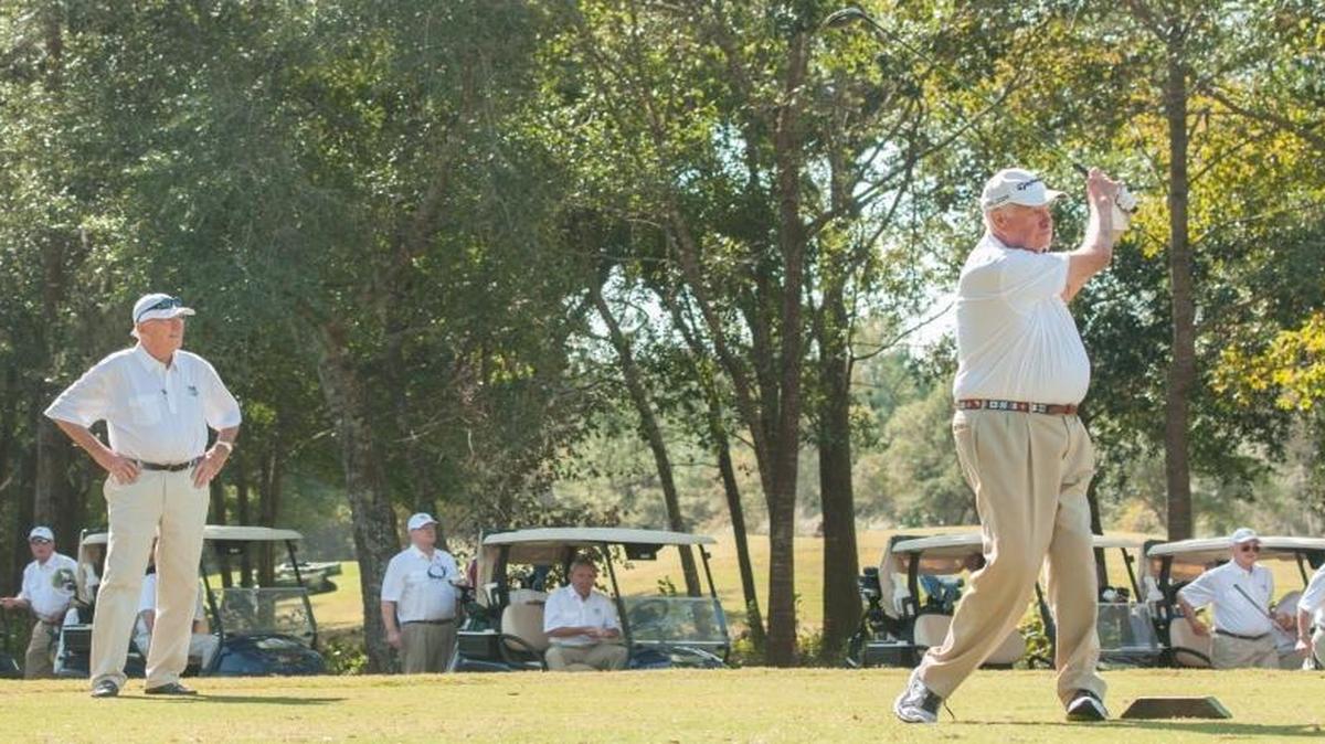 Bruce Michelsen, who is part of a group from the Raleigh, N.C., area that has made 100 golf trips to the Grand Strand, hits a shot last October.
