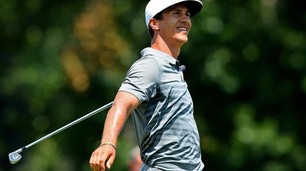 Thorbjorn Olesen smiles as he watches his drive from the 17th tee box during the first round of the PGA Championship at Quail Hollow Club in Charlotte, N.C. on Thursday.