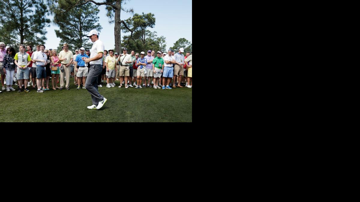 
Rory McIlroy walks past spectators on the seventh hole during a practice round for the Masters golf tournament on Wednesday in Augusta, Ga.
