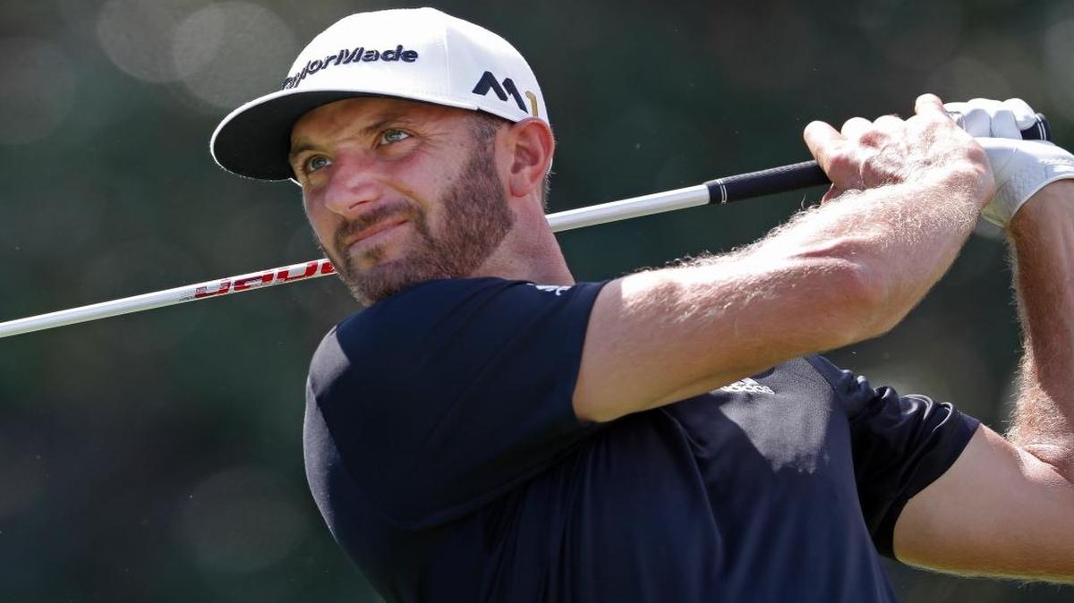 Dustin Johnson hits from the tee on the 14th hole during the third round of the Tour Championship.