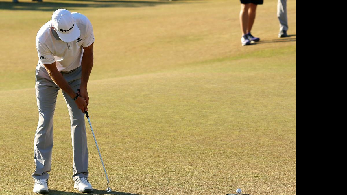 
Dustin Johnson three-putts on the 18th hole during the final round of the U.S. Open.
