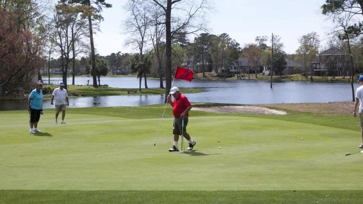 Golfers play the seventh hole at Arcadian Shores Golf Club, a Rees Jones design, last month.