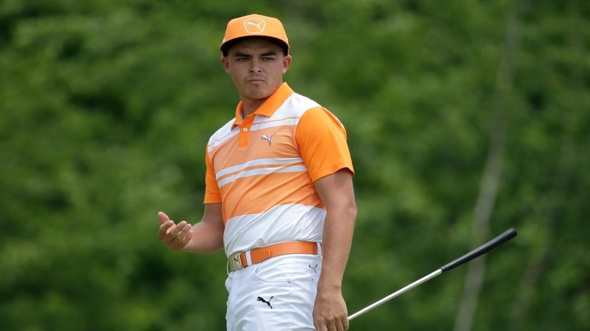 Rickie Fowler reacts to missing his putt on the first hole during the final round of the Wells Fargo Championship.