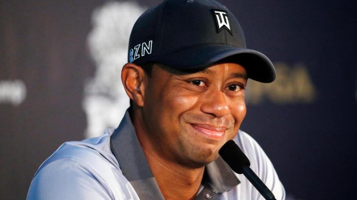 
Tiger Woods talks in the media room after a practice round for the PGA Championship.
