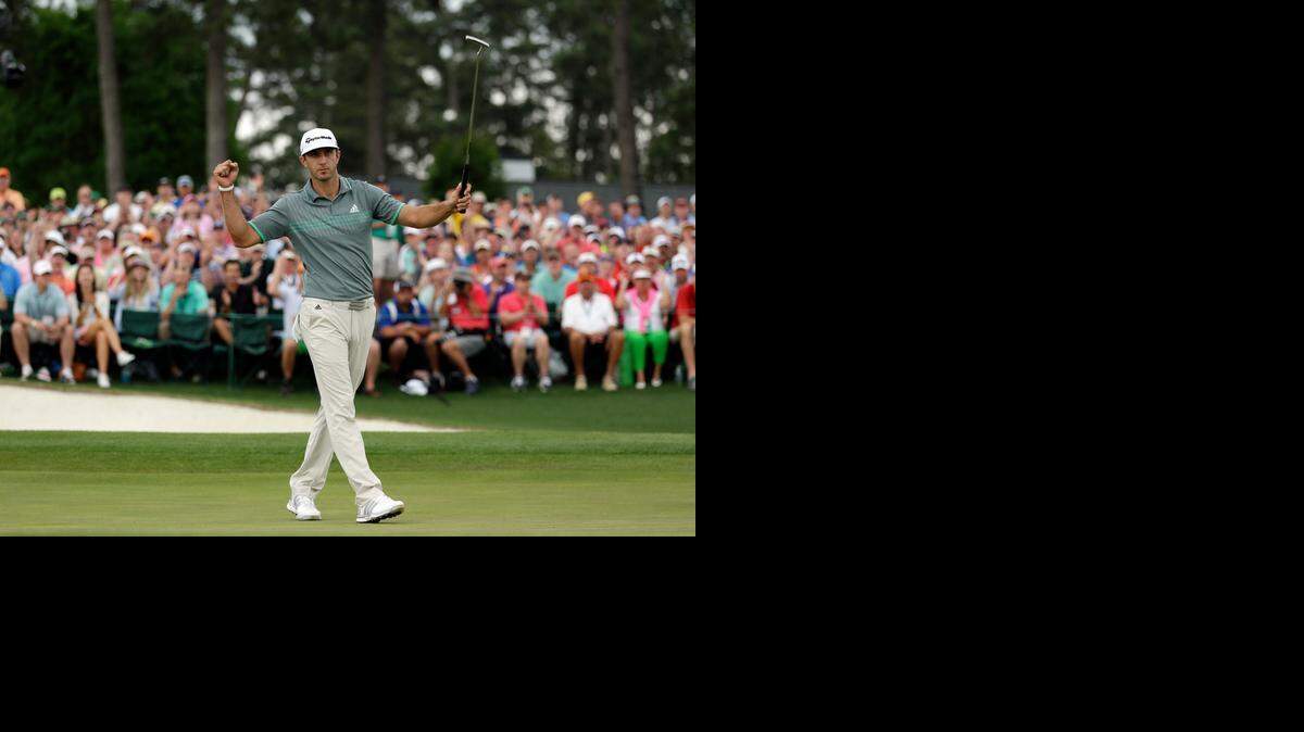 
Dustin Johnson celebrates after a birdie on the 18th hole during the final round of the Masters.
